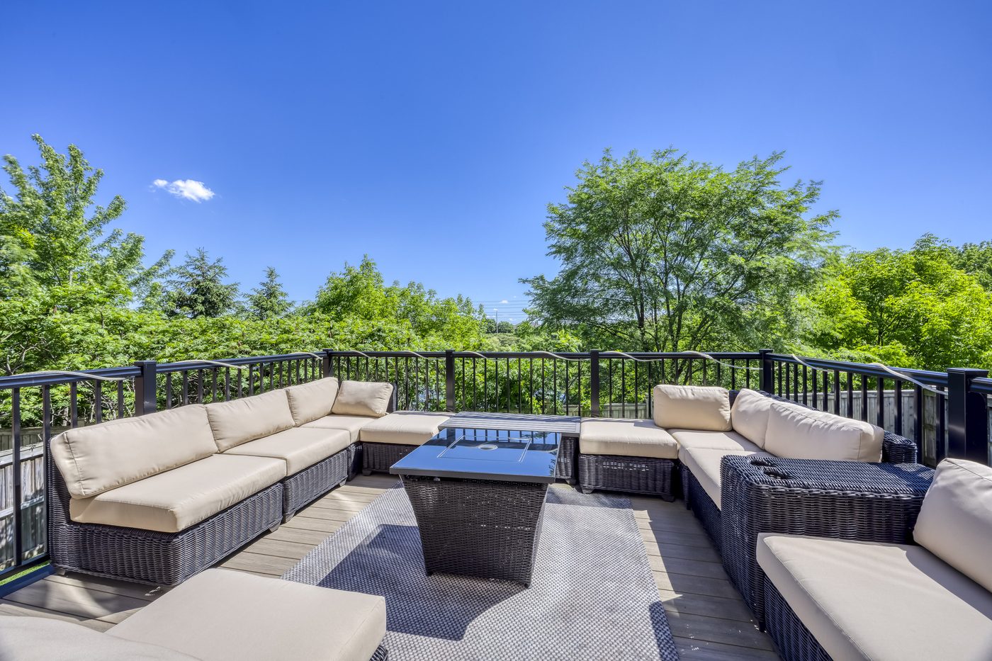 A rear deck backing onto trees in Halton