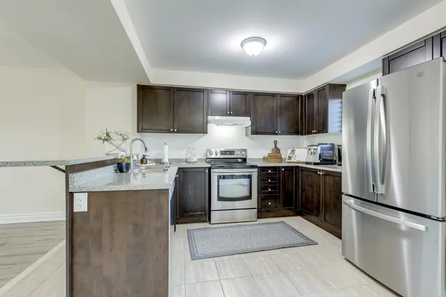 Kitchen with stove and French-door refrigerator