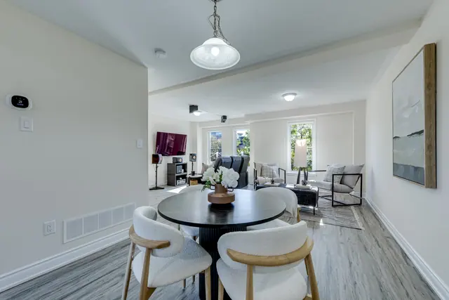 Dining table with the family room beyond