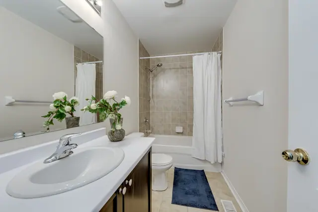 Main bathroom with tub and shower