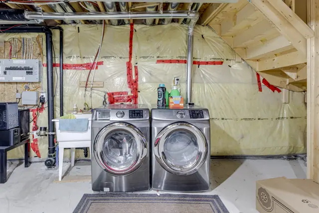 Unfinished lower level with washer and dryer