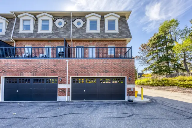 Garage doors at the back of the townhomes